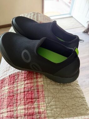 OOFOS womens Slip-On Sneakers in Black with Neon Green Insole